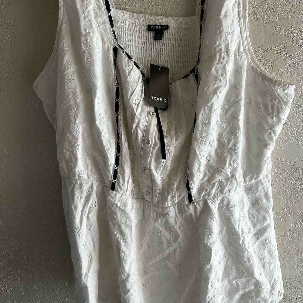 2 Torrid tops. One still has tags. Size 2